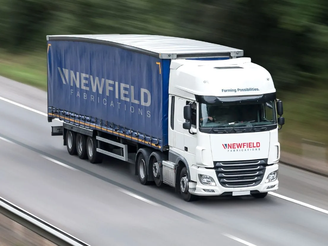 A Newfield Fabrications delivery lorry on the motorway